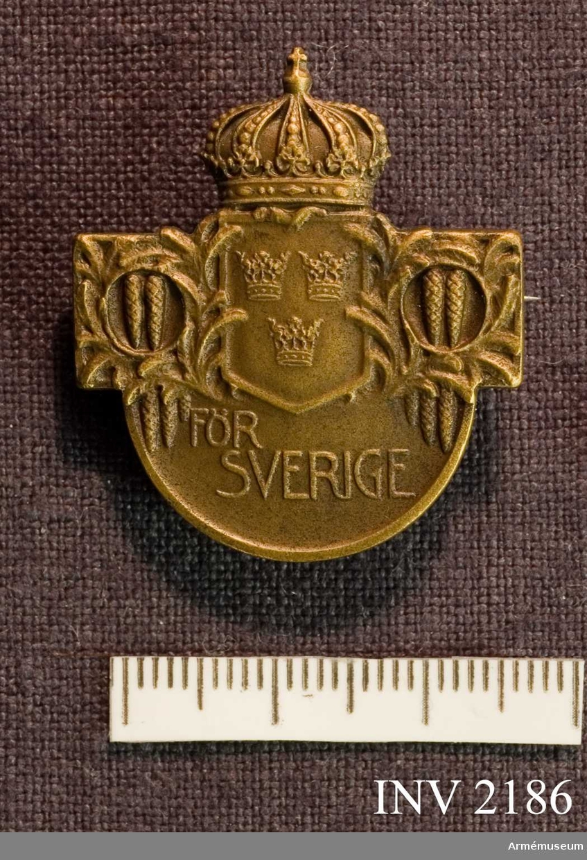 Samhörande nr är 2170-2188.Märke, riksidrotts-, brons, generalitet.På framsidan ett krönt märke med lilla riksvapnet och  inskription "för Sverige". På baksidan "41666 G.R. Erlandsson" och "C.C. SPORRONG & CO  STOCKHOLM".