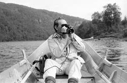 Elvebåt i landskap.