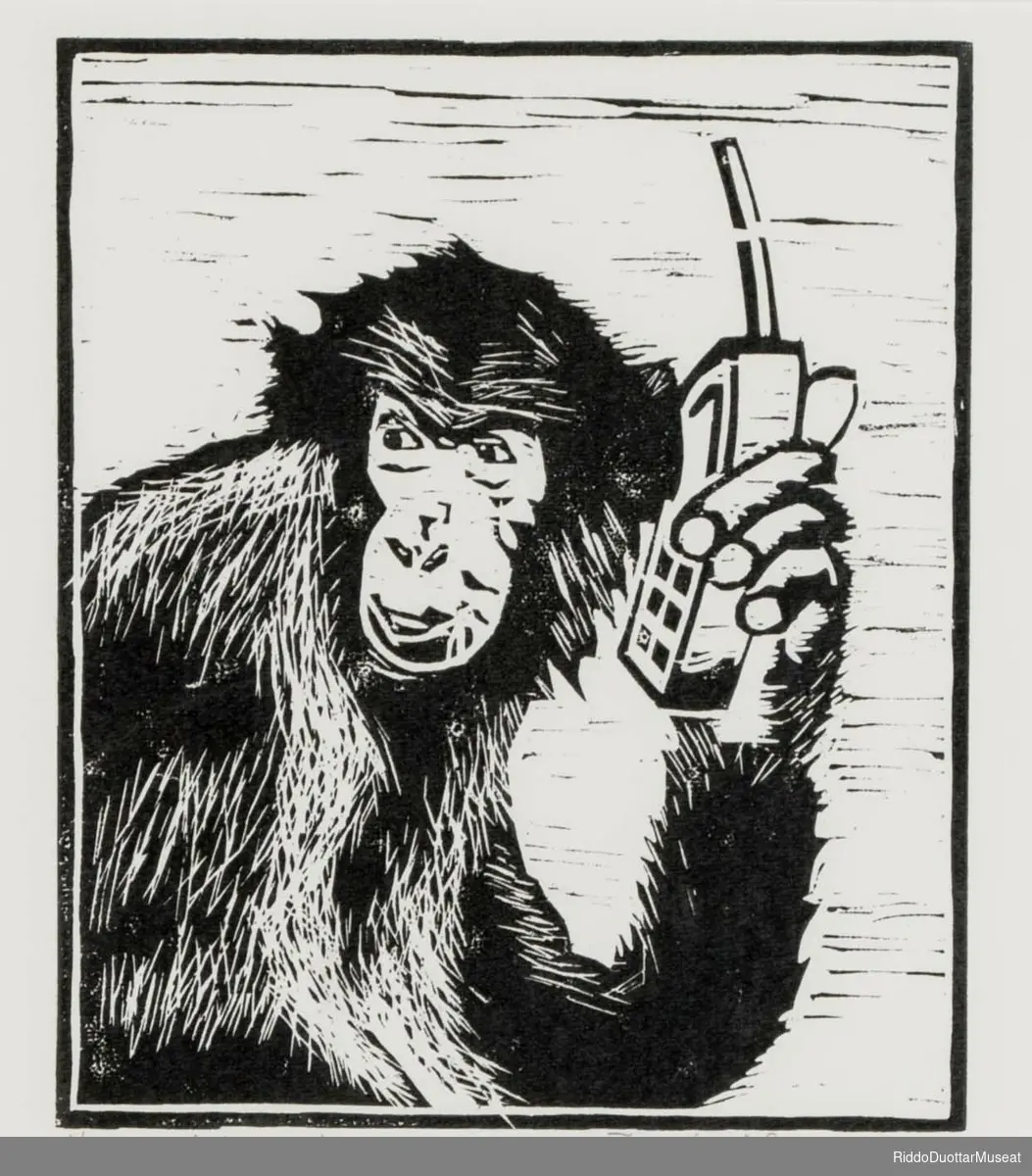 Ape med mobiltelefon.