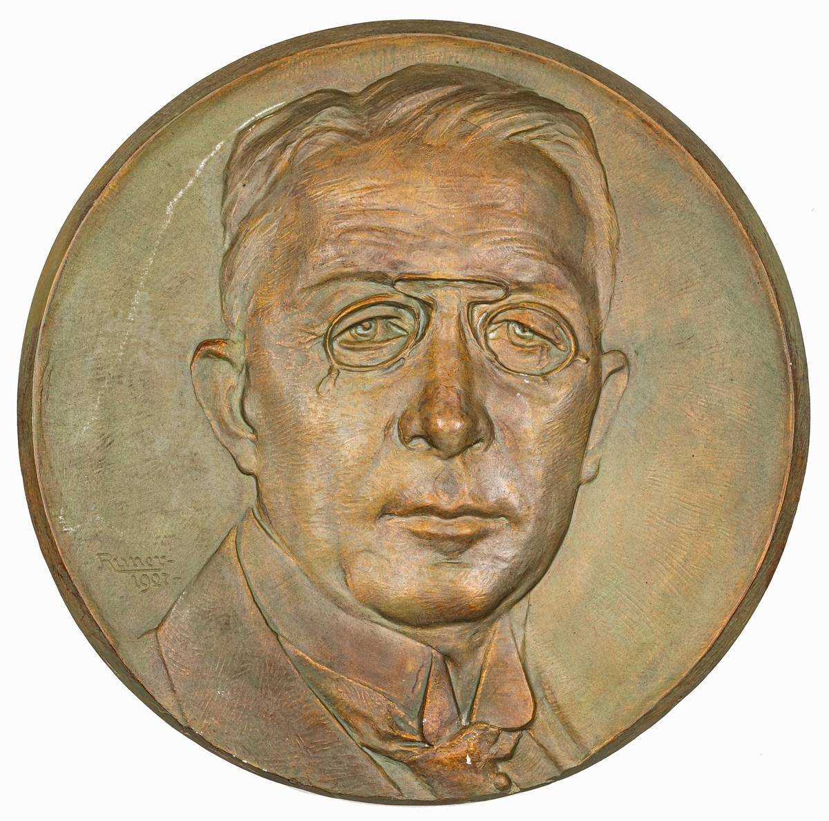 Porträttrelief signerad J. Runer 1927.