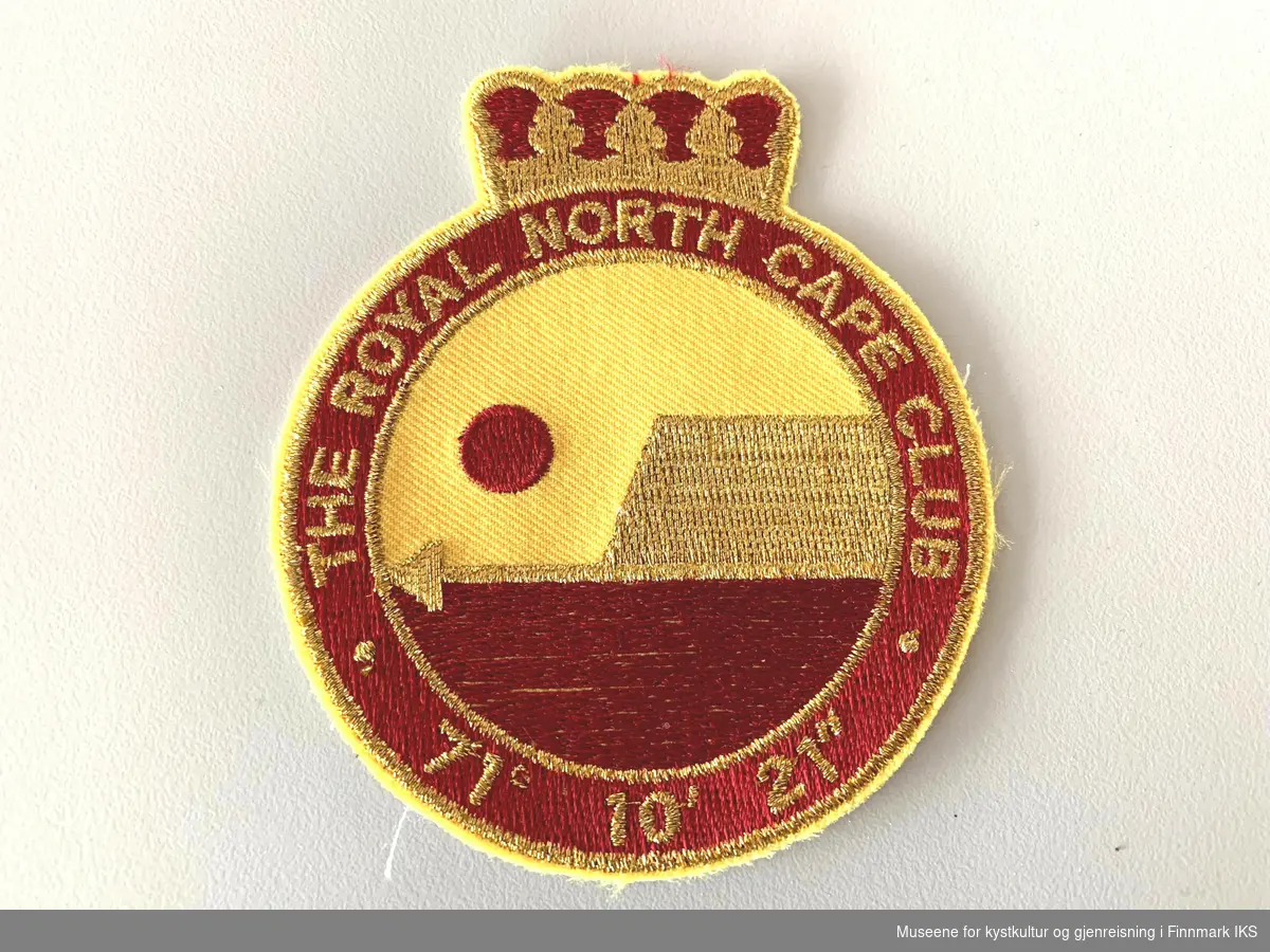 Logoen til The Royal North Cape Club (RNCC) som stoffmerke. Nyere versjon.