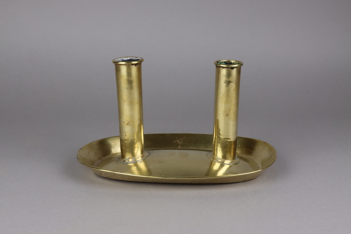  with twin candle holders, push up slid with thumb holder shaped as a leaf. Oval domed sauce shaped base with rim. One push up lid is missing.