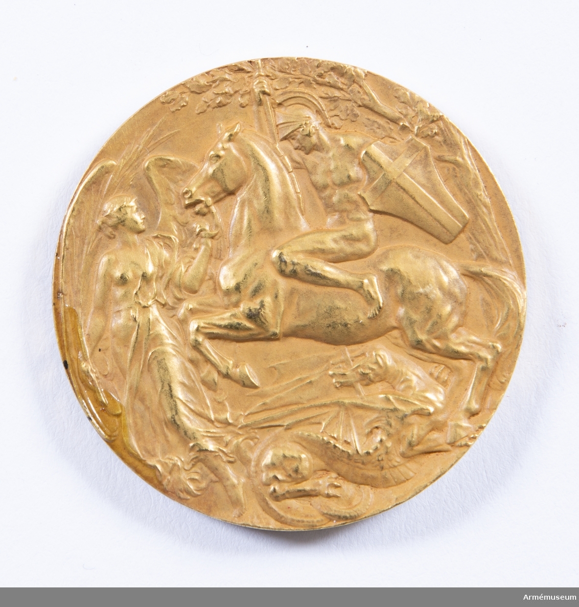 Grupp M II.
Guldmedalj vunnen av Oscar Gomer Swahn i löpande hjort, enkelskott, OS 1908 i London.
