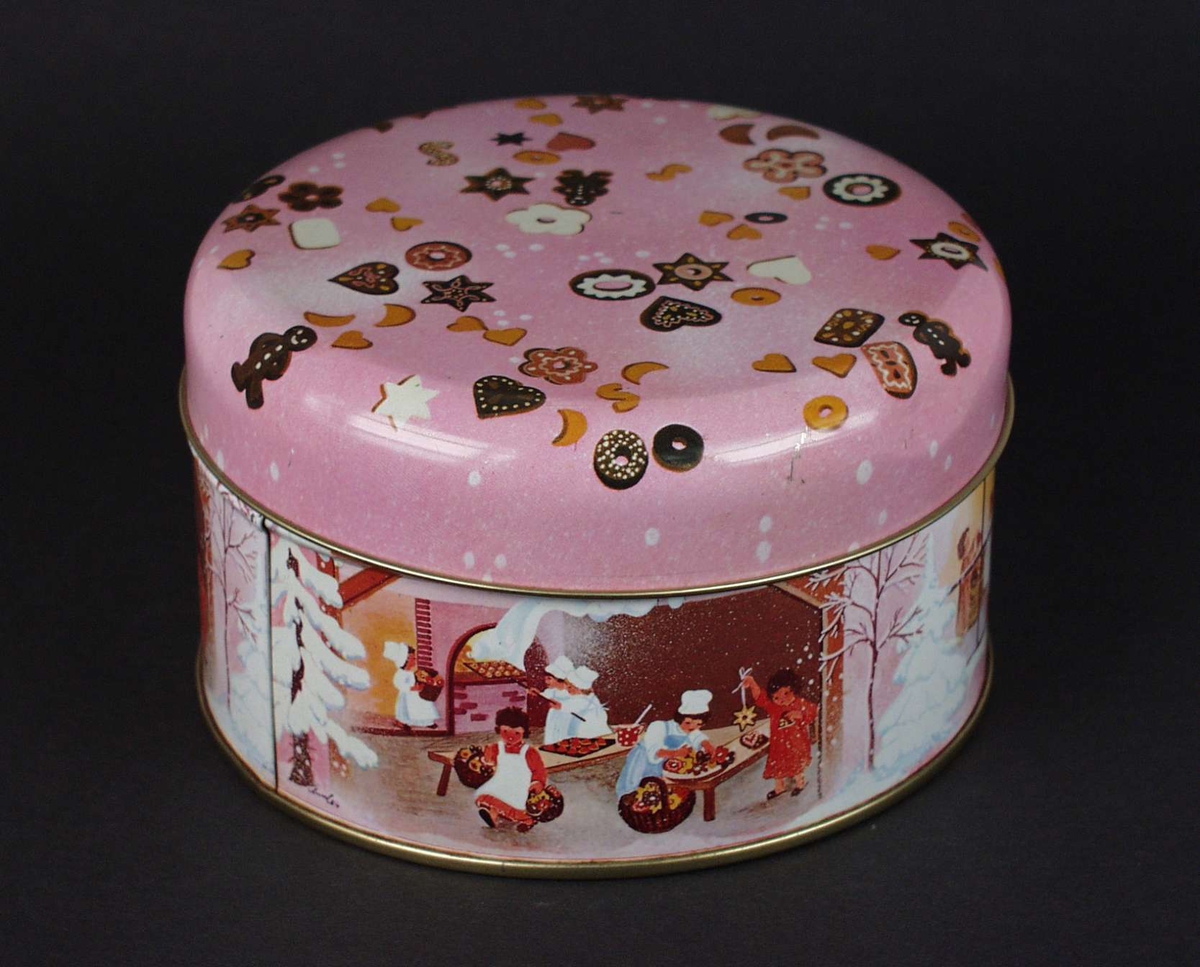 Rund rosa kakeboks med julemotiv.