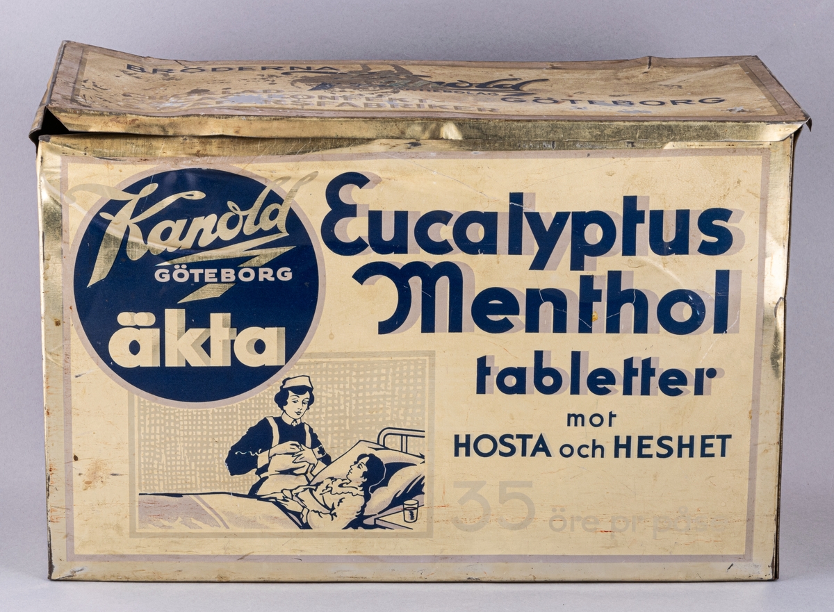 Plåtburk, rektangulär, ljusgul med blå text och mönster. Text på burken: Kandold GÖTEBORG äkta Eucalyptus Menthol tabletter mot HOSTA och HESHET.