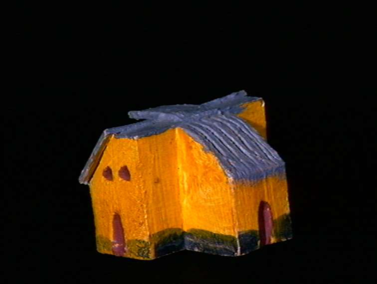 Sett med ca 200 leketøyhus laget av tre i forskjellige former og farger.