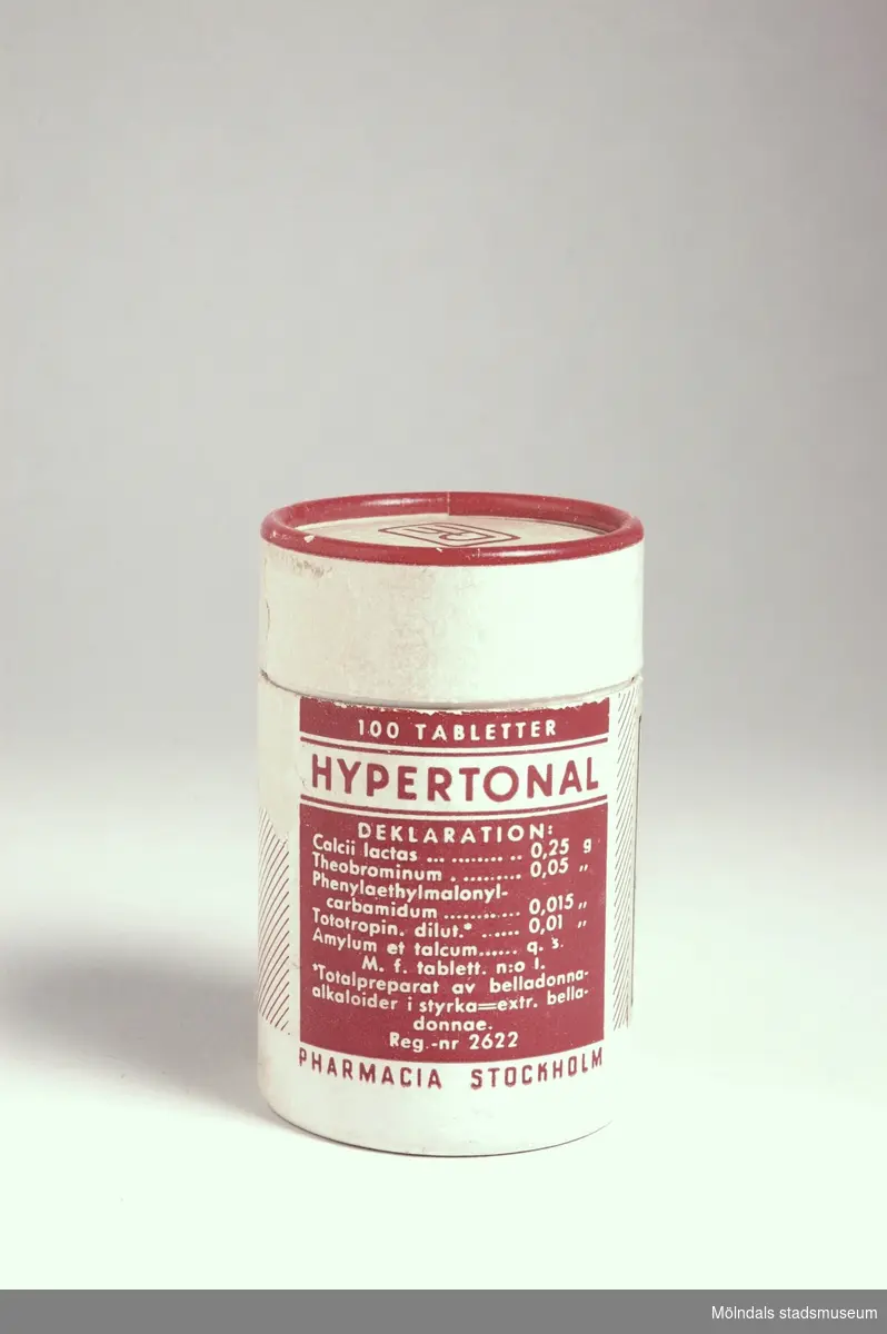 Medicinburk av rund pappkartong med lock. Innehöll Hypertonal tabletter. Etikett från Mölndals apotek.