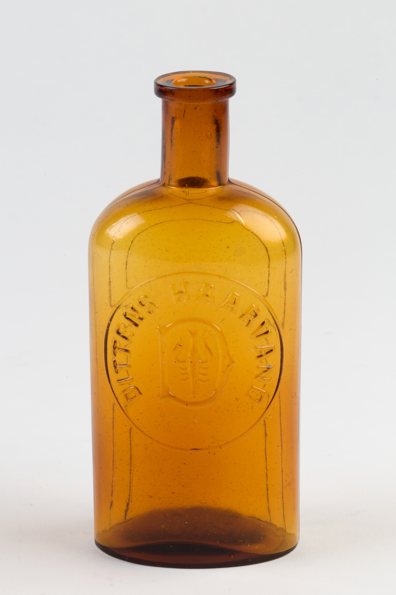 Oval glassflaske med hals, brukt til hårvann.