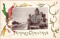 fotografi av slott/hotell på klippe ved havet på postkort