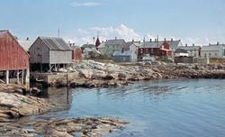 Foto fra noen av bolighusene på fiskeværet Grip, nå i Kristi