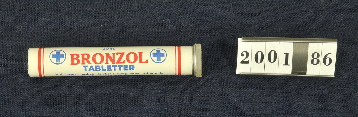 Vitt rör med text i blått och rött. Har innehållit 20 st Bronzol tabletter. Innehållsdeklaration står på röret. 

En känd reklamslogan, till och med 1970-talet, för produkten löd: Hälsa för halsen - Bronzol!
