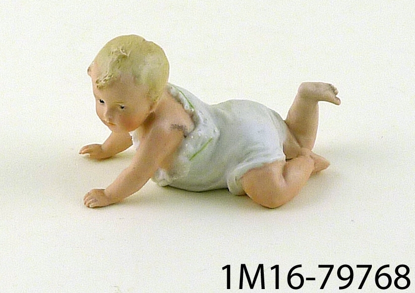 Porslinsask i form av krypande spädbarn.