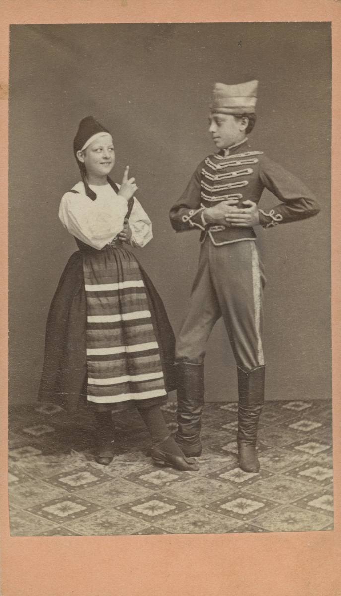 Ida Eckhéll. Pojke och flicka i folkdräkter, 1871.