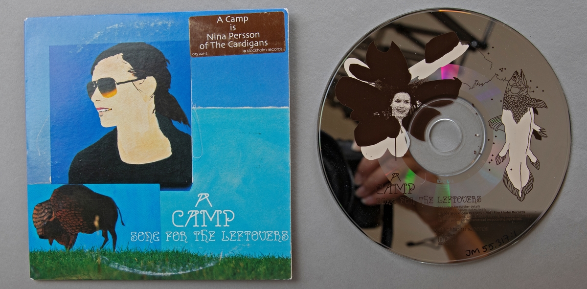 CD-skiva, musik med gruppen A Camp med Nina Persson. Skiva i pappkonvolut.

Innehåll:
1. Song for the Leftovers
2. Train for salvation

JM 55317:1, Skiva
JM 55217:2, Konvolut