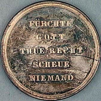 Minnesmynt eller medalj i silver, med motiv av Jesus och fariséerna.
Tysk text på myntets baksida: "Fürchte Gott Thue Recht Scheue niemand", det vill säga ungefär "Frukta ingen människa men frukta Gud"