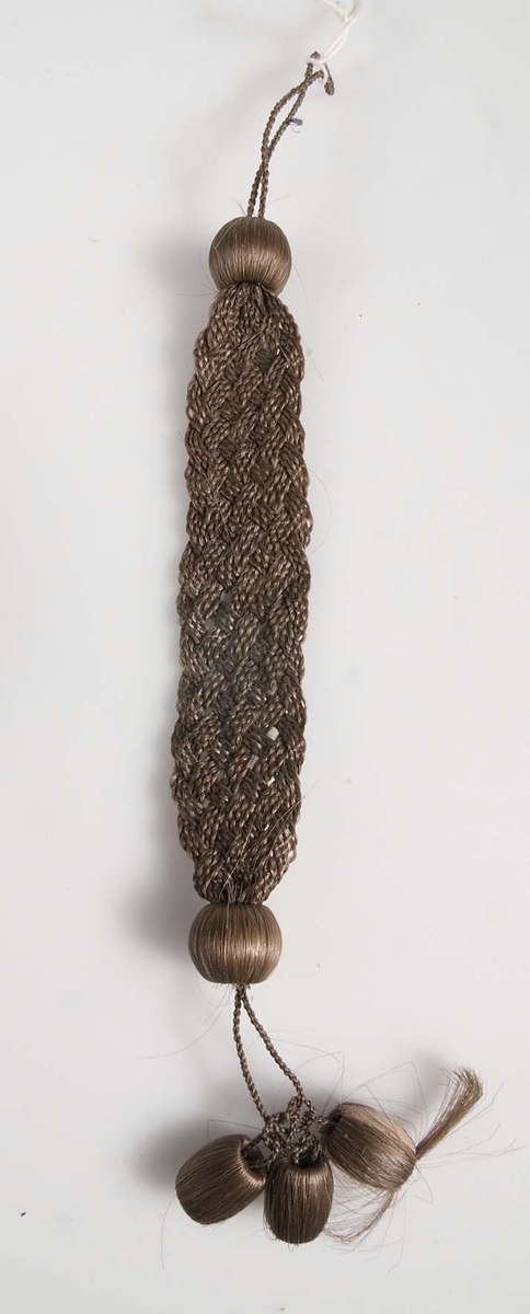 Armband, hårarbete, tillverkat av brunt hår.