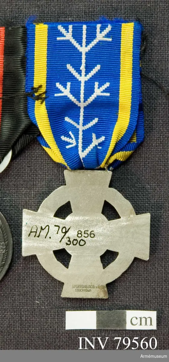 Grupp M II.
Medalj, Frivilligkorset för Förbundet Svenska Finlandsfrivilliga.
