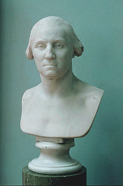 Houdon blev tidigt berömd för sina porträtt av 1700-talets politiker, författare och kungligheter. År 1785 reste han över Atlanten i förhoppning om att göra en ryttarstaty av det nordamerikanska frihetskrigets hjälte George Washington. Washington avböjde. Istället gjorde Houdon en porträttbyst i bränd lera (terrakotta), av vilken denna skulptur är en variant i marmor. Frisyren är modern, men allvaret, realismen och nakenheten anspelar också på den antika romerska republikens porträttkonst. År 1789 blev Washington den förste amerikanske presidenten.