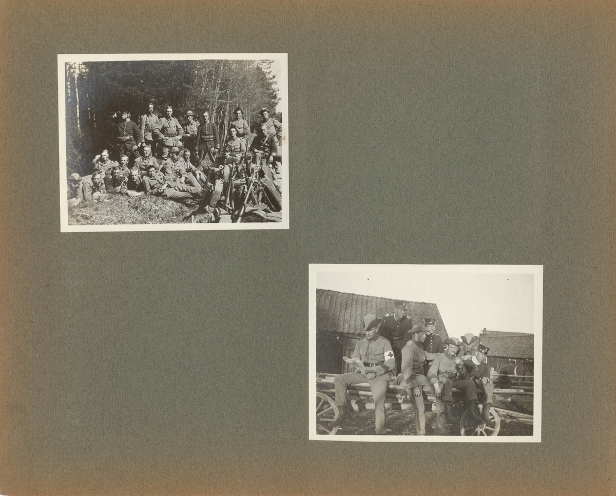 Gruppbild av soldater från Göta livgarde I 2 sittande på en vagn.