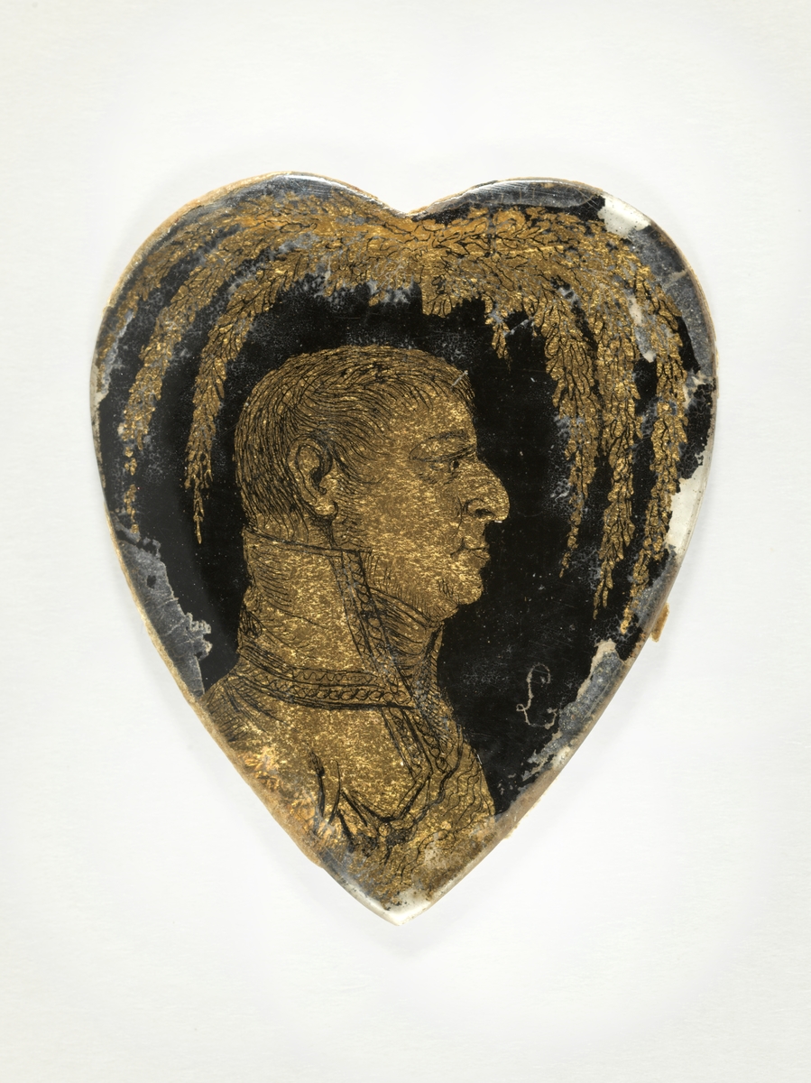 Portrett av Prinsen av Augustenborg i gull mot sort bakgrunn.