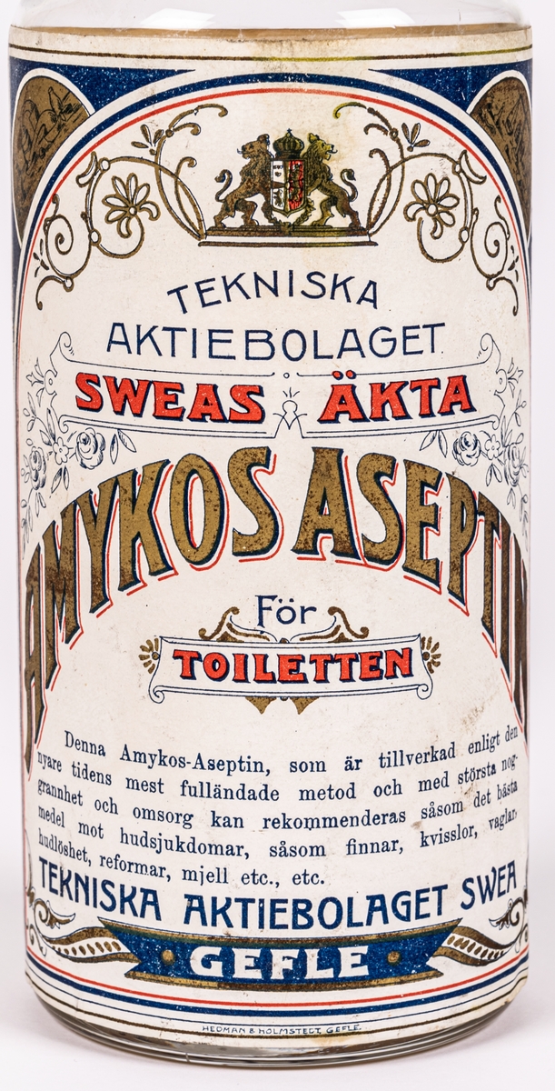 Glasflaska. 
Etikett med text; 
Tekniska aktiebolaget
Sweas Äkta
Amyktos-Aseptin. 
För toiletten.