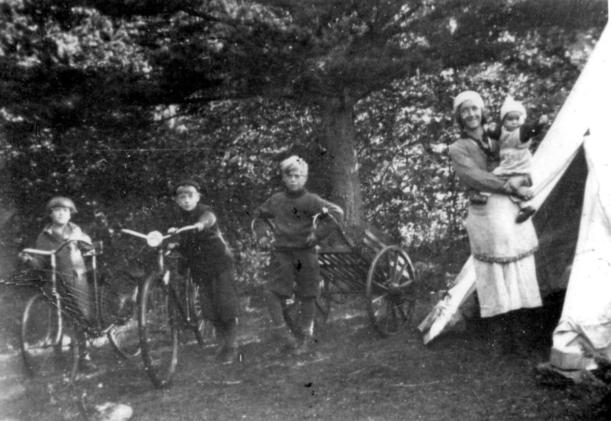Children playing with bicycles.