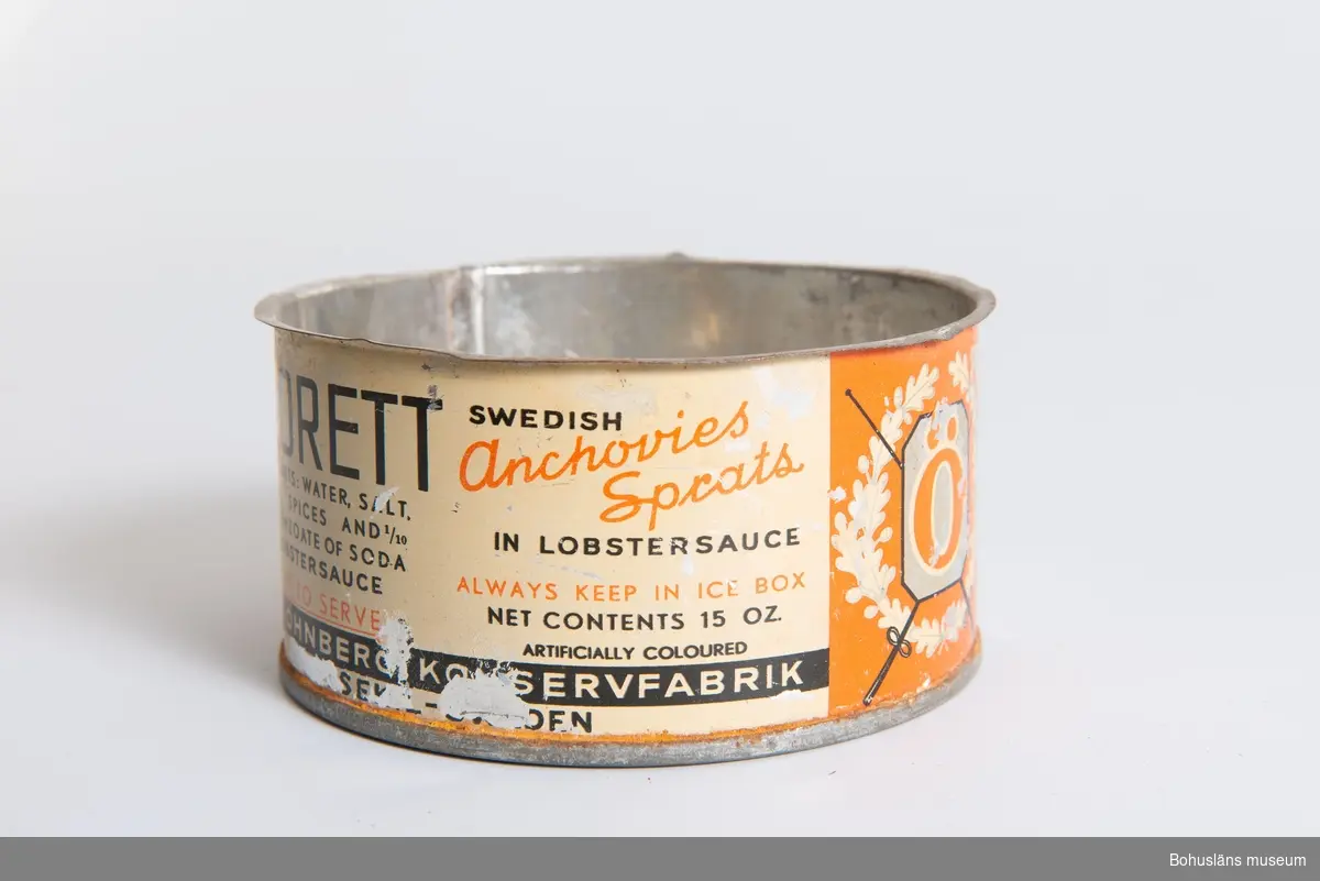 Konservburk för: "Florett anchovis sprats in lobstersauce".
Röd och vitlackad burk med engelsk text. Från Öhnbergs konservfabrik.