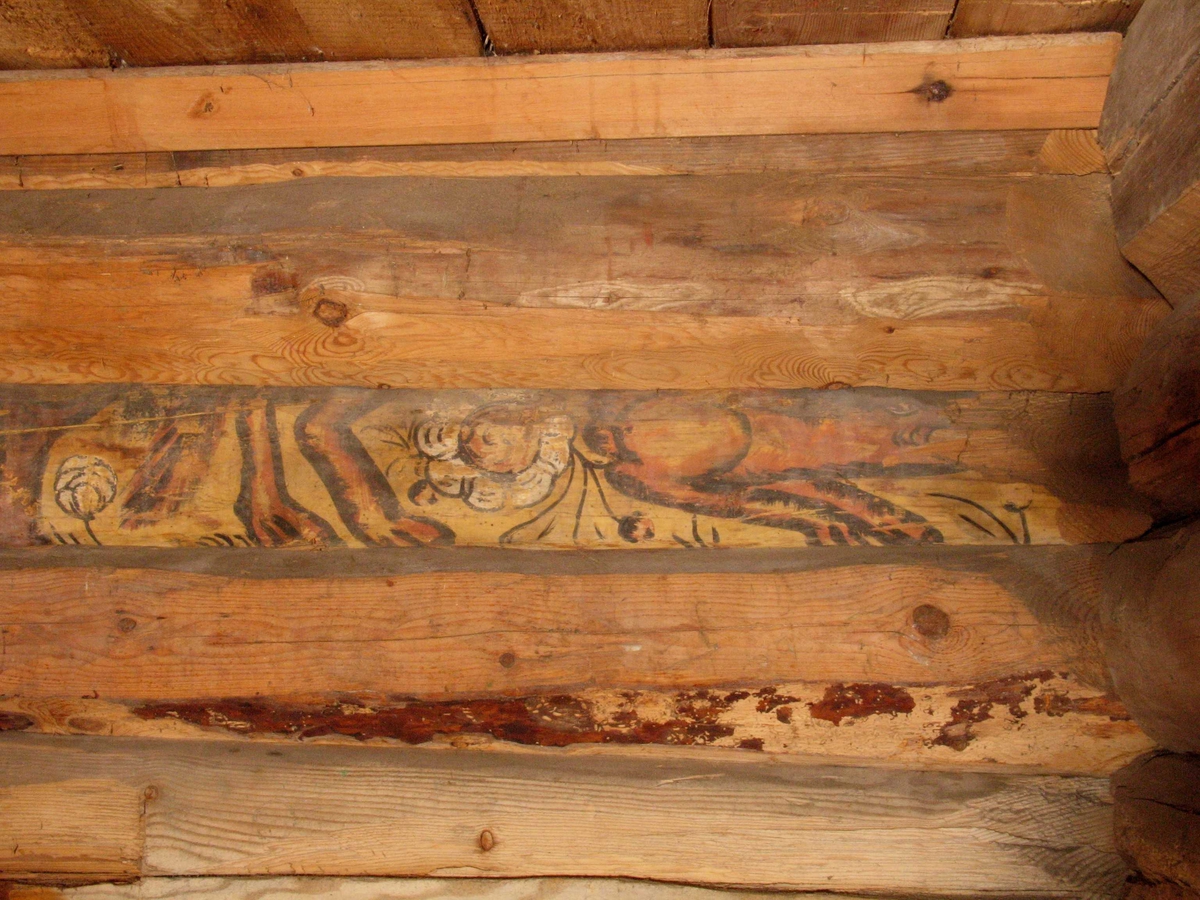 Merdøgaard, sjøboden. Detalj fra interiør av salteboden, gjenbrukt tømmer med dekorasjonsmaling, trolig fra 1600-tallet. 