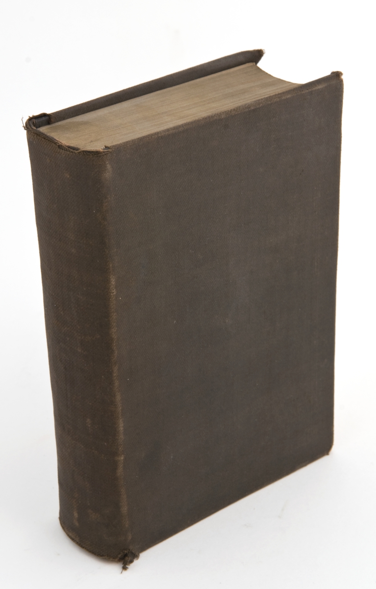 Bibel med mørkt gråbrunt tekstiltrekk og gullsnitt.