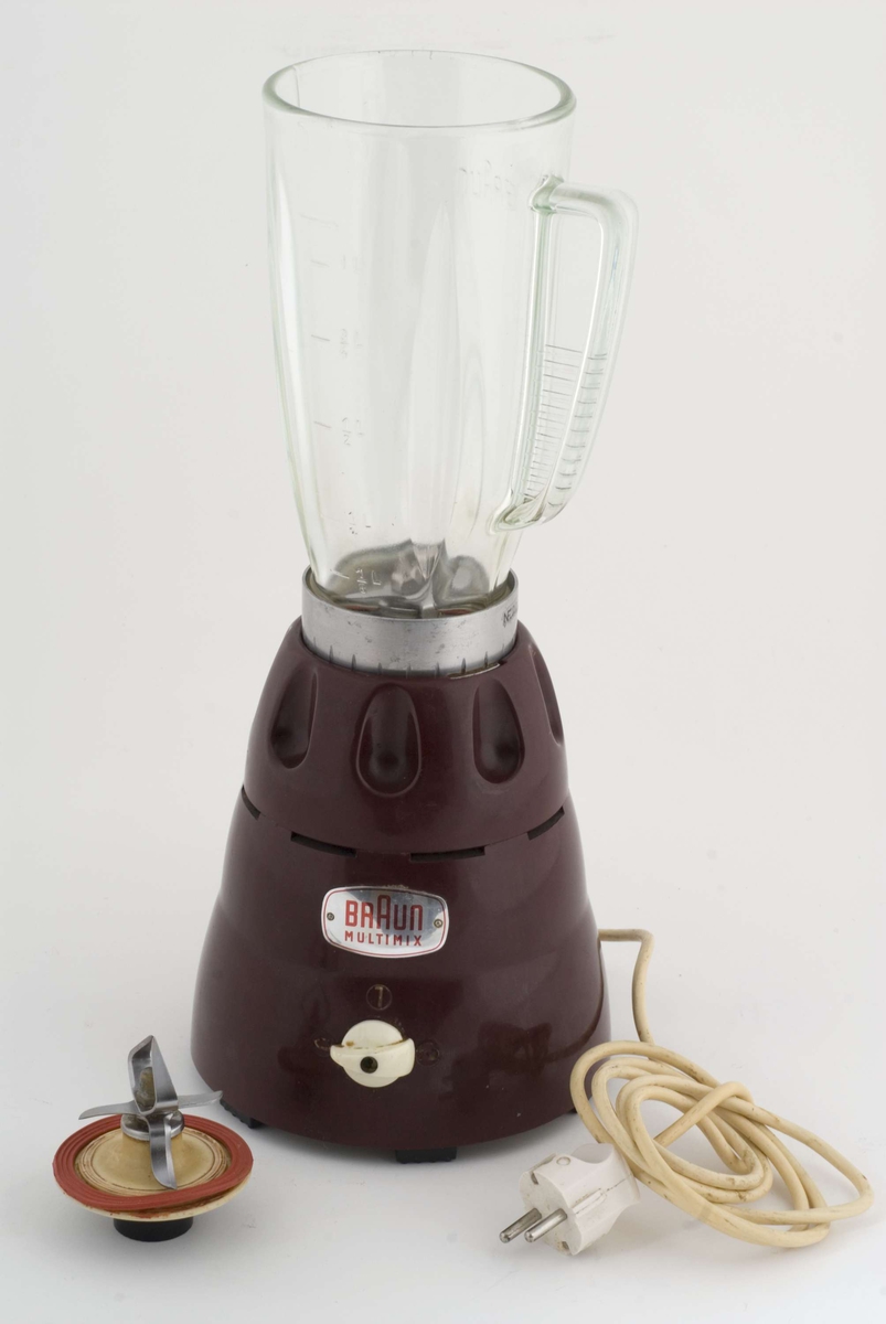 Elektrisk kjøkkenmaskin i to deler: burgunderrød nederdel med beholder i tykt,, ufarget glass. 