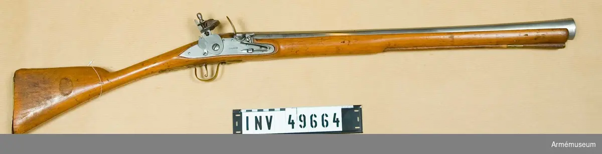 Grupp E XIV.
Loppets relativa längd är 18 kal. Afrikanskt gevär med flintlås i form av trompon (ströbössa).  "Barker". På pipans och kolven står nummer 234.
