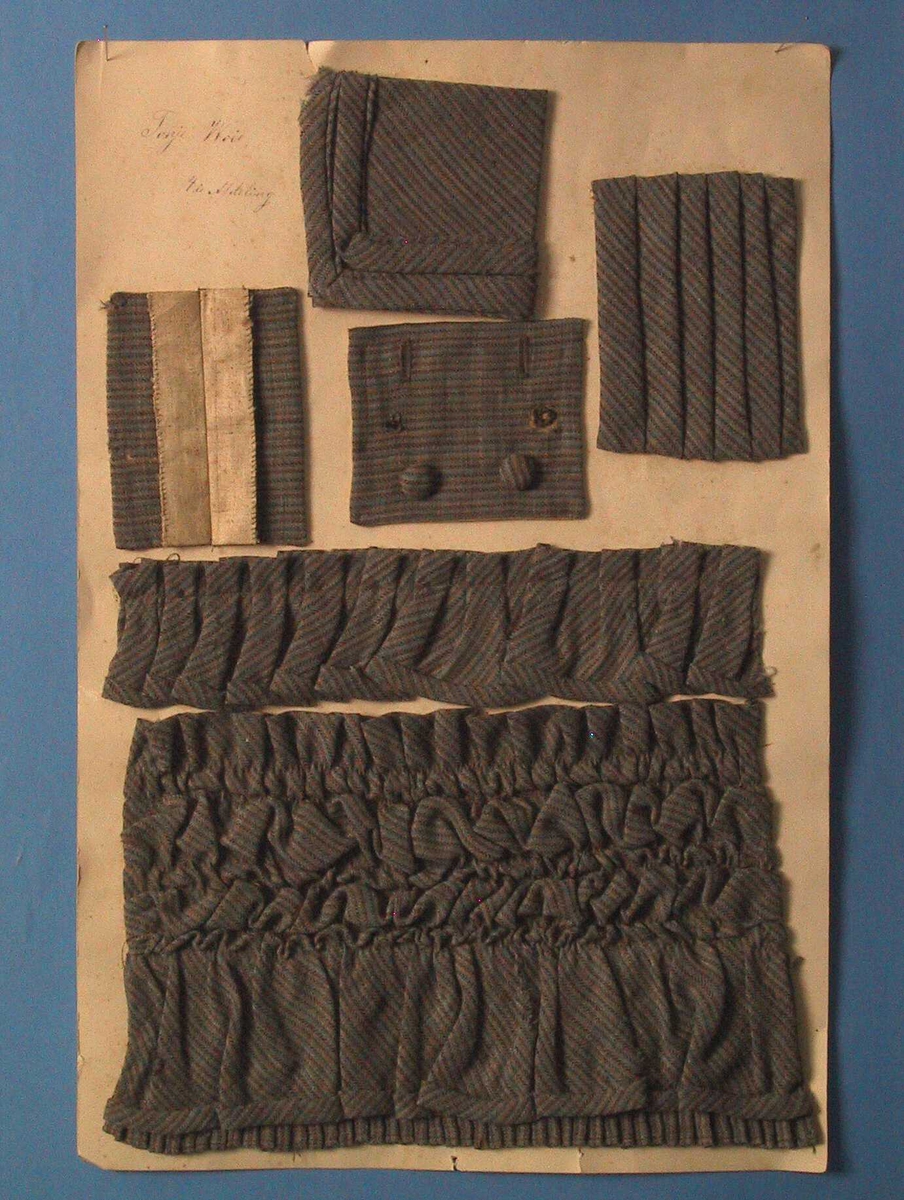Tekstilprøve montert på kartong
